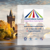 A transparent square with the logo of GES2024, date and time of the event and partners logo centered. In the background, a photo of Prague with river, bridge and some historical building during daylight.
