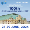The poster of IALP 100th anniversary celebration, from 27-29 June, 2024. On the background, an historical building in Vienna.